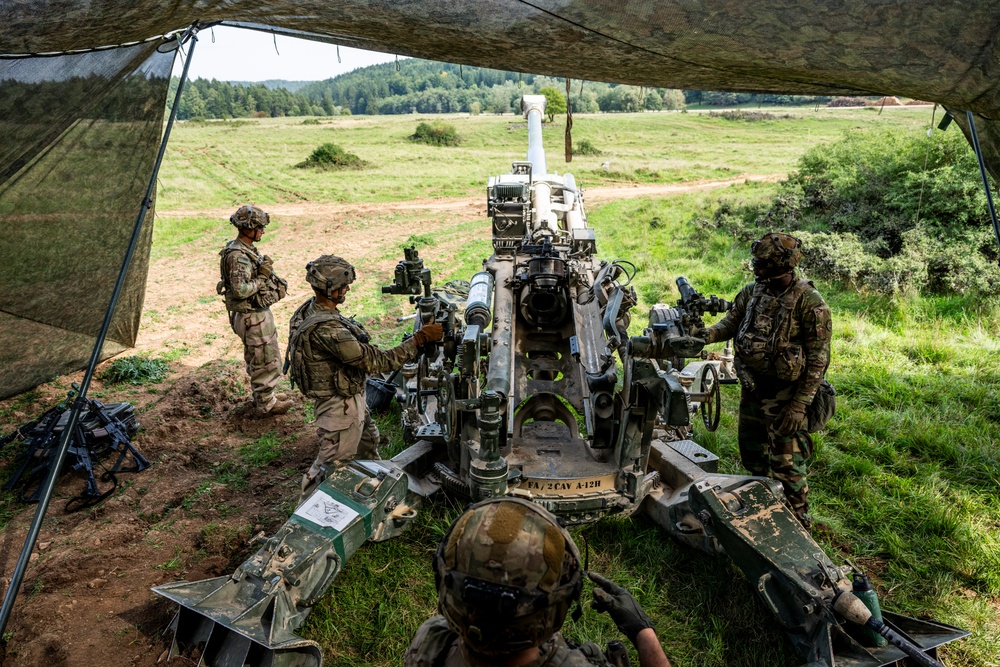 Field artillery crews set up positions at Saber Junction 23