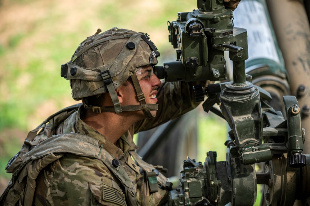 Field artillery crews set up positions at Saber Junction 23