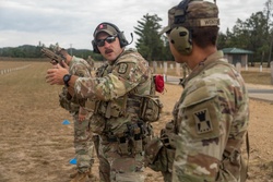 Staff Sgt. Daniel Kelley instructs Pfc. Vincent Wentorf on M17 pistol marksmanship [Image 2 of 6]