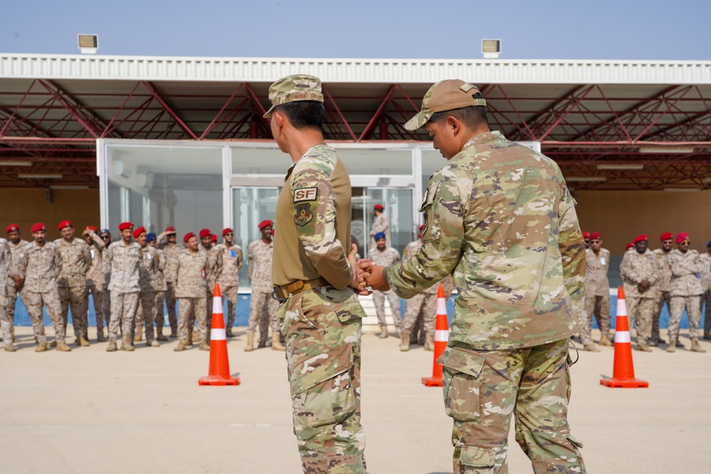 378th ESFS demonstrates police tactics to RSAF