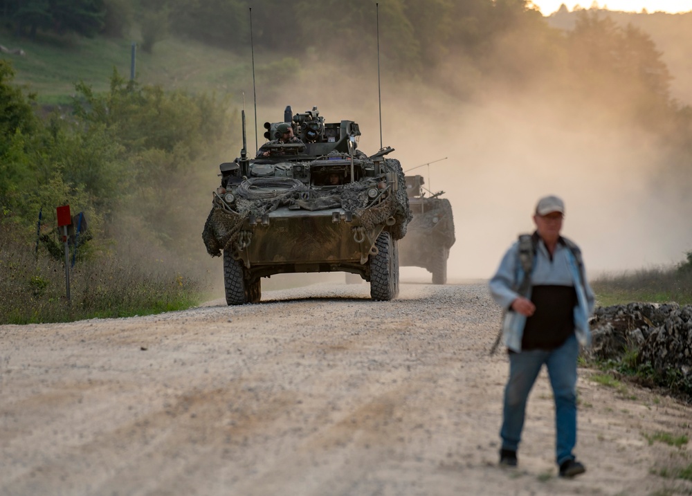 Opposition forces roll into a training village at Saber Junction 23