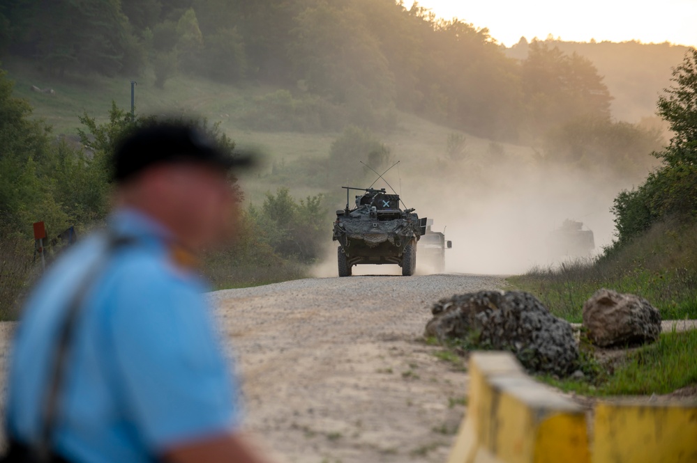 Opposition forces roll into a training village at Saber Junction 23