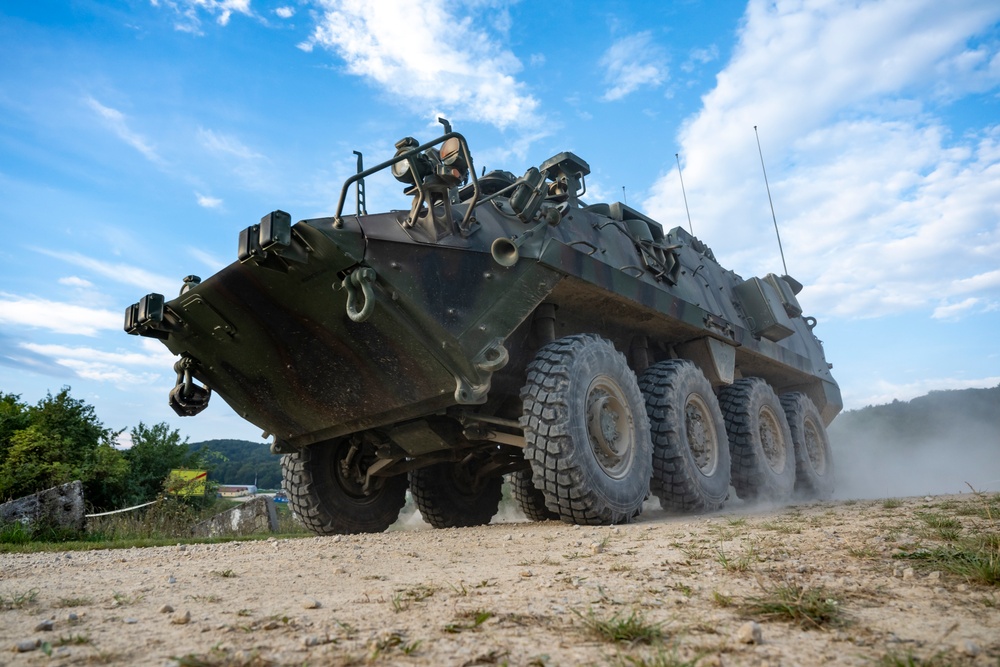 Opposition forces roll into a training village at Saber Junction 23