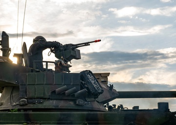 Opposition forces roll into a training village at Saber Junction 23