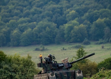 Opposition forces roll into a training village at Saber Junction 23