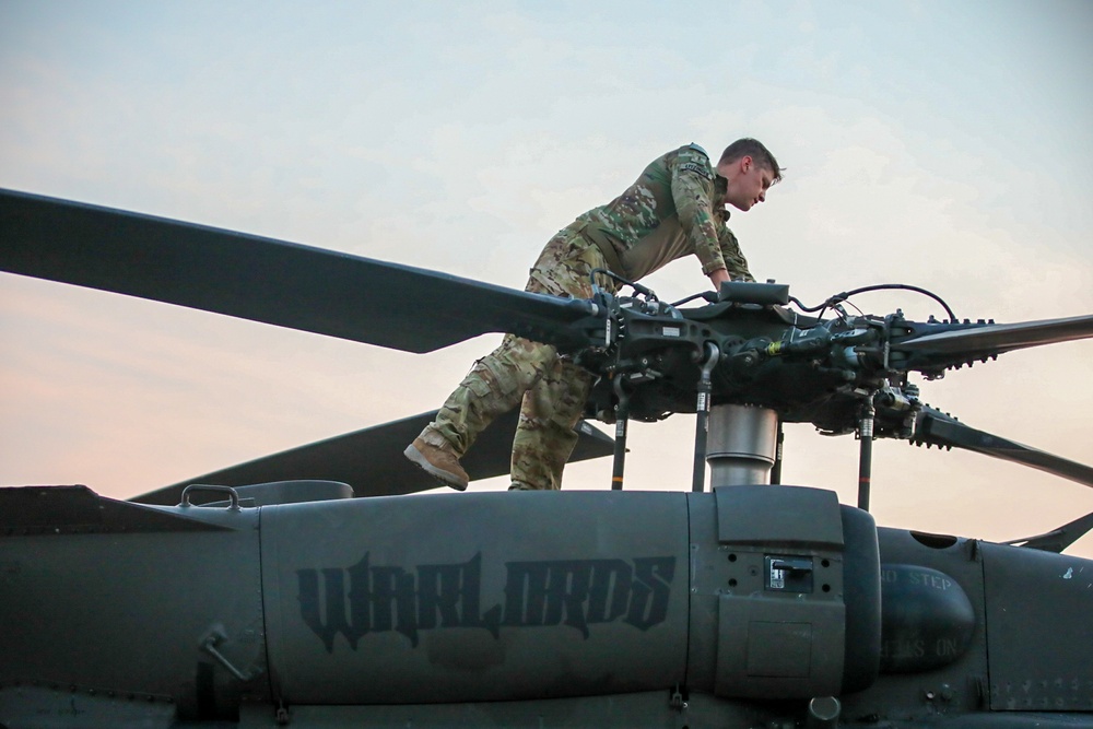 A Pilot Conducts an Inspection of His Aircraft