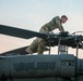 A Pilot Conducts an Inspection of His Aircraft