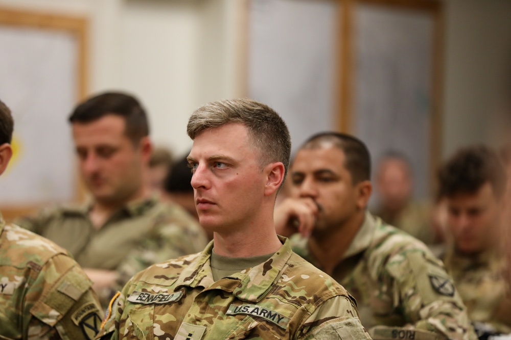 A Pilot Listens Intently During an After Action Review