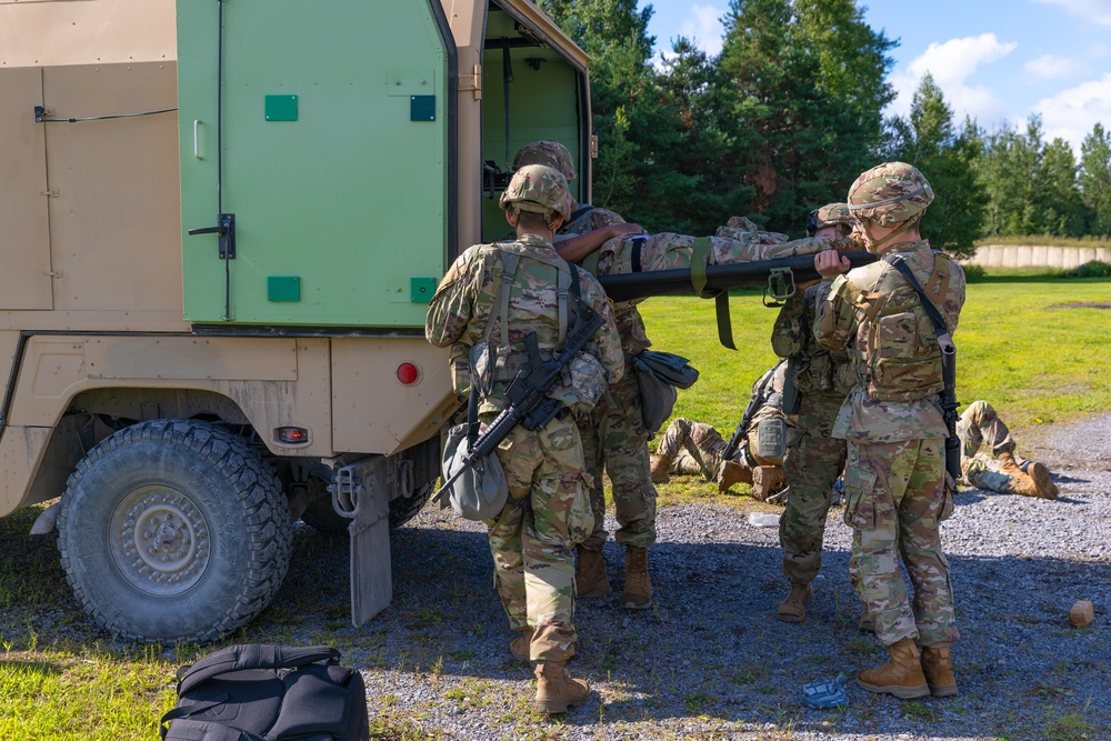 Photo By Sgt. Matthew Lucibello | Connecticut Army National Guard combat medic specialists load simulated casualties into the back of an M997A3 High Mobility Multipurpose Wheeled Vehicle (HMMWV) ambulance during a mass casualty exercise, part of annual training, at Fort Drum, New York, Aug. 13, 2023. Ambulances from the 141st Medical Company (Ground Ambulance) were responsible for the medical evacuation of simulated wounded soldiers during the exercise. To expedite this process, ambulances were staged throughout the training area and on standby to retrieve the wounded and transport them to the 118th Medical Battalion’s aid station, where they were able to be treated. (U.S. Army photo by Sgt. Matthew Lucibello)