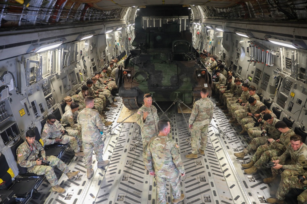 1st Battalion 64th Armor Regiment soldiers practice loading M2A4 Bradley on and off C-17 Globemaster III.