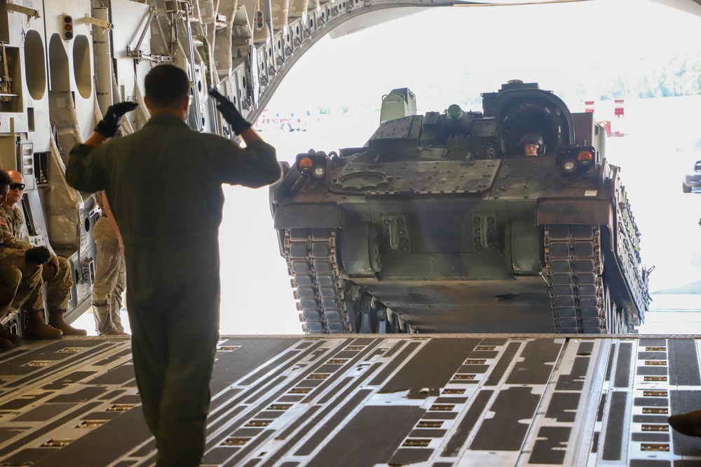 1st Battalion 64th Armor Regiment soldiers practice loading M2A4 Bradley on and off C-17 Globemaster III.