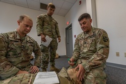 Sgt. 1st Class Joshua Nash demonstrates tactical combat casualty care techniques to the 2023 Army Reserve Best Squad winners [Image 2 of 4]