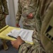 Spc. Hayse Jorgensen takes notes during tactical combat casualty care