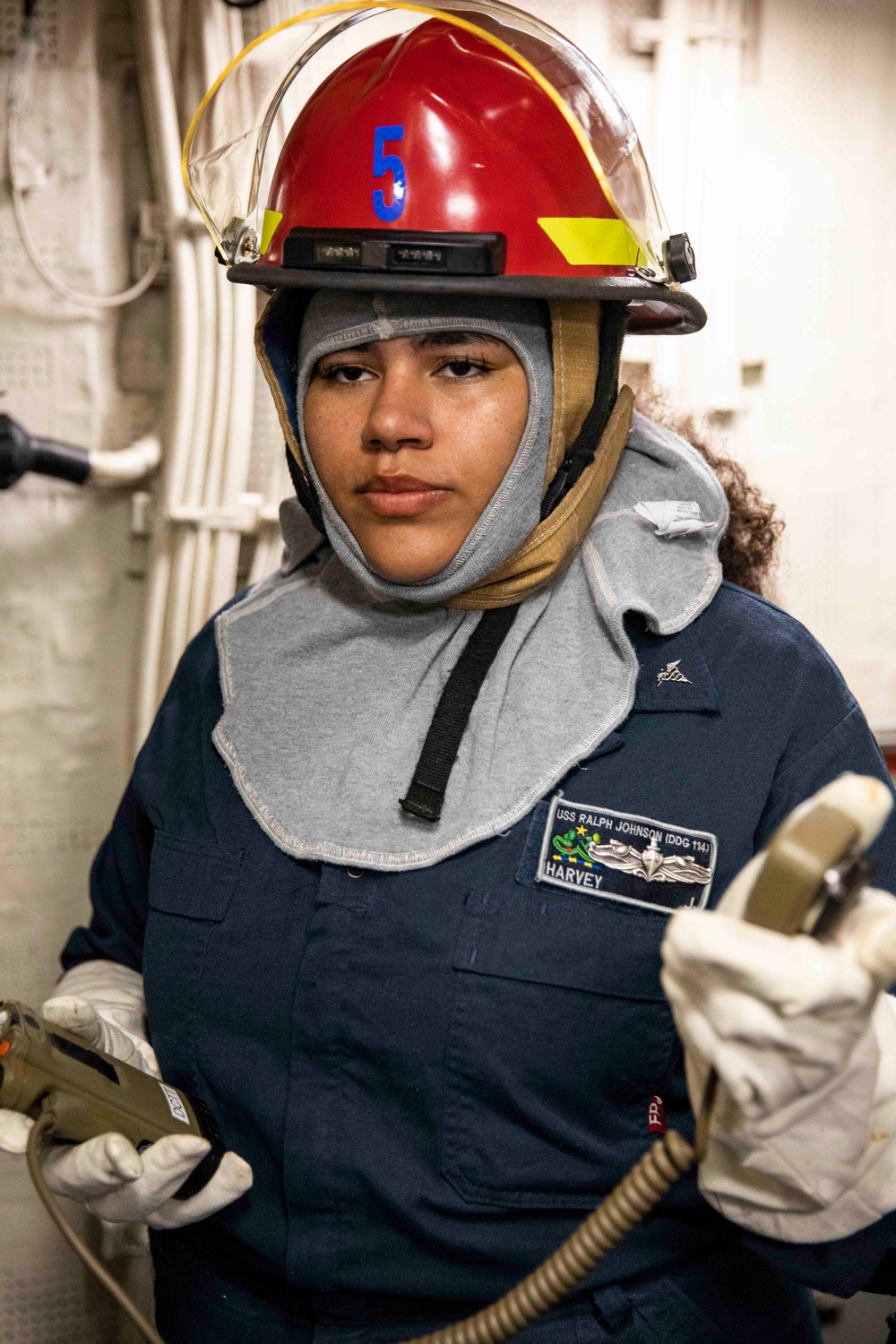 USS Ralph Johnson Sailors conduct IET drill.