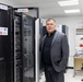 Technology and Information Systems Director, Eng. Ahmad Abu Soud, stands in Aqaba Water Company’s server room.