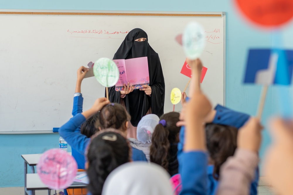 Ola Abu Assab uses USAID learning support materials to teach her class at Umm Kulthum Secondary School for Girls in Zarqa.