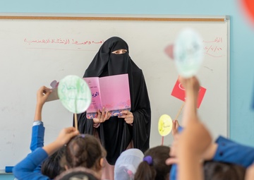 Ola Abu Assab uses USAID learning support materials to teach her class at Umm Kulthum Secondary School for Girls in Zarqa.