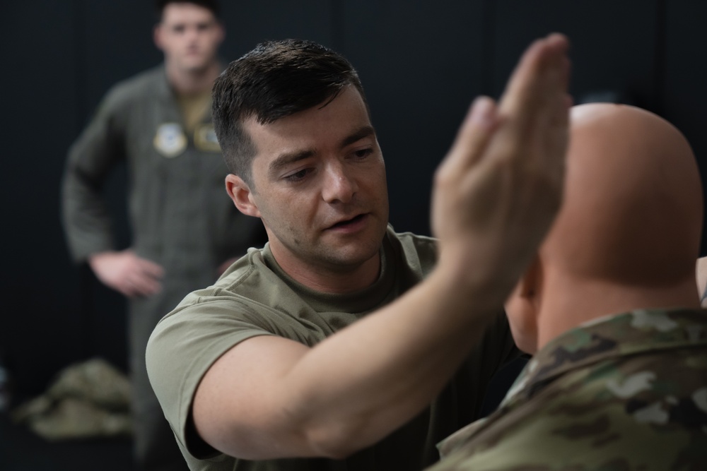 MacDill aviators learn combatives in SERE course