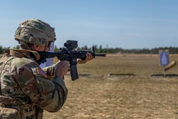 Spc. Peter Martin fires an M4 rifle during training at Fort [Image 2 of 7]