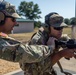 Sgt. Maj. Russell Moore gives shooting tips to Pfc. Vincent Wentorf