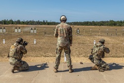 Warrant Officer Drew Wood leads two members of the 416th Theater Engineer Command squad through marksmanship drills [Image 5 of 7]