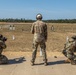 Warrant Officer Drew Wood leads two members of the 416th Theater Engineer Command squad through marksmanship drills