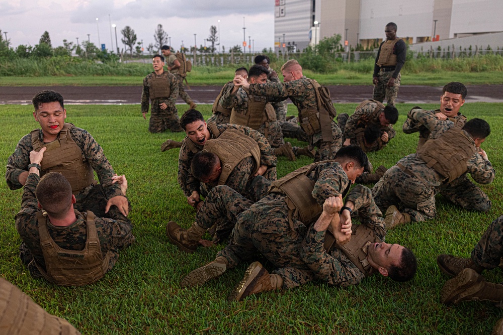 U.S. Marines conduct morning physical training for a Martial Arts Instructor course