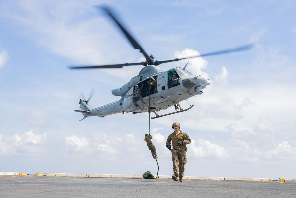 U.S. Marines Conduct Fast Rope Aboard The USS Greenbay