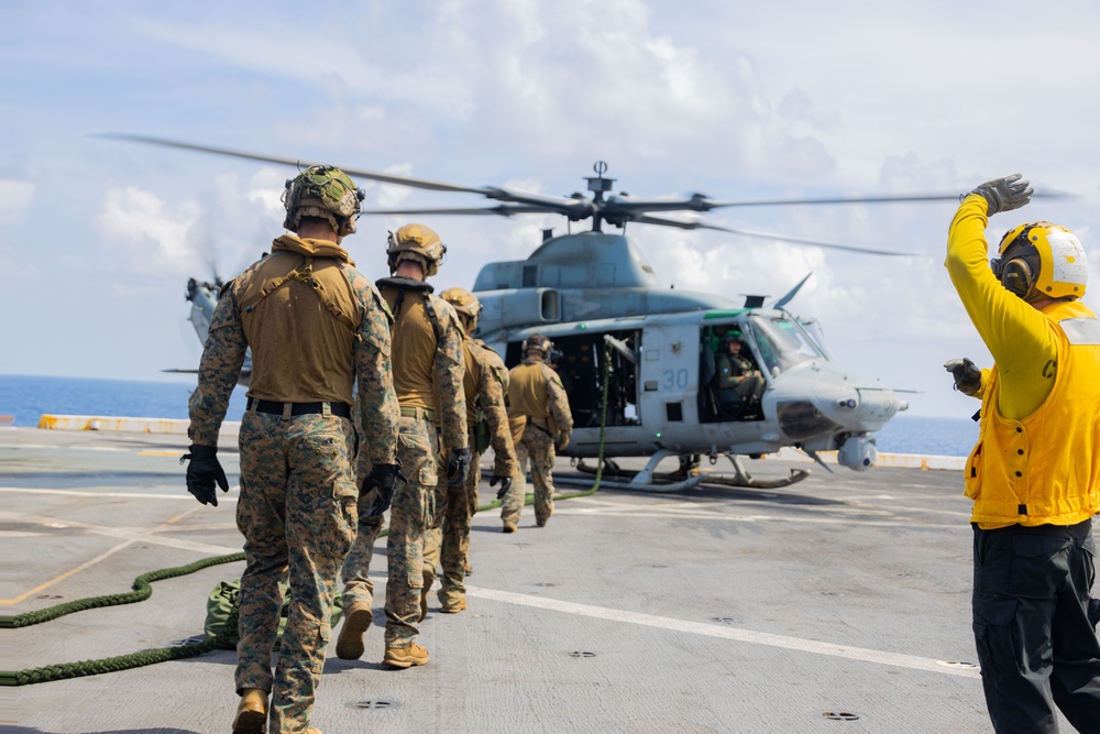 U.S. Marines Conduct Fast Rope Aboard The USS Greenbay