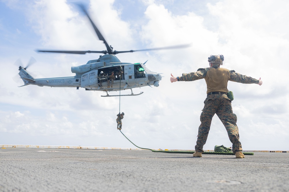 U.S. Marines Conduct Fast Rope Aboard The USS Greenbay