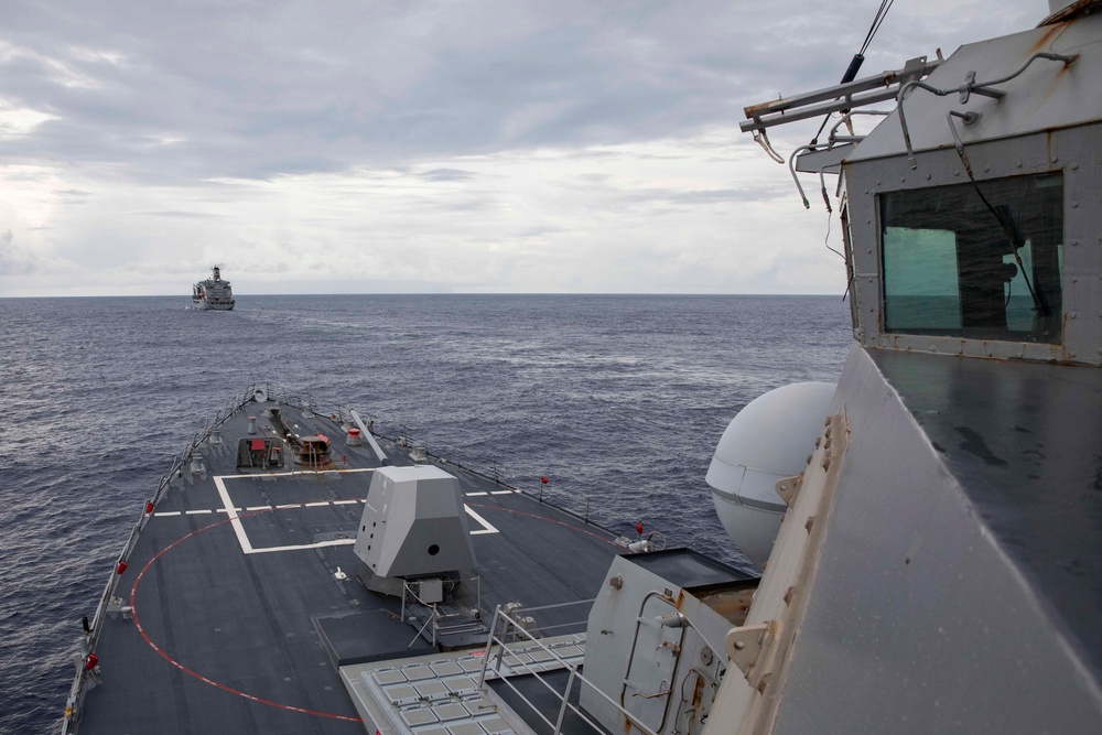 USS Ralph Johnson and His Majesty’s Canadian Ship (HMCS) Ottawa (FFH 341) conduct a replenishment-at-sea with the USNS Yukon.