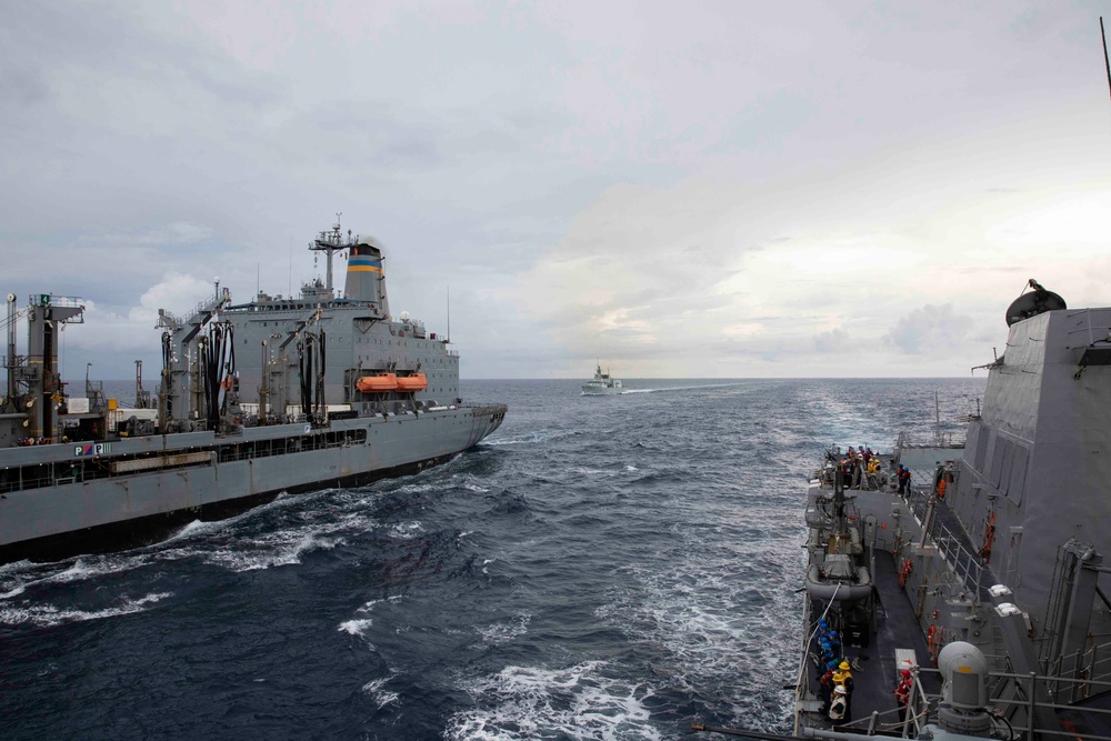 USS Ralph Johnson and His Majesty’s Canadian Ship (HMCS) Ottawa (FFH 341) conduct a replenishment-at-sea with the USNS Yukon.