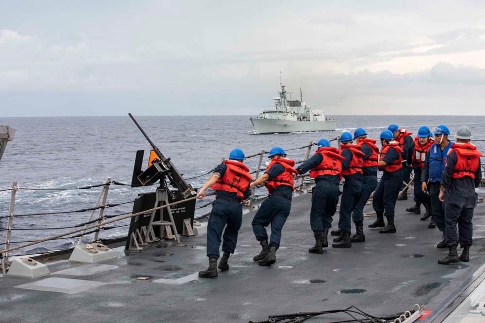 USS Ralph Johnson and His Majesty’s Canadian Ship (HMCS) Ottawa (FFH 341) conduct a replenishment-at-sea with the USNS Yukon.