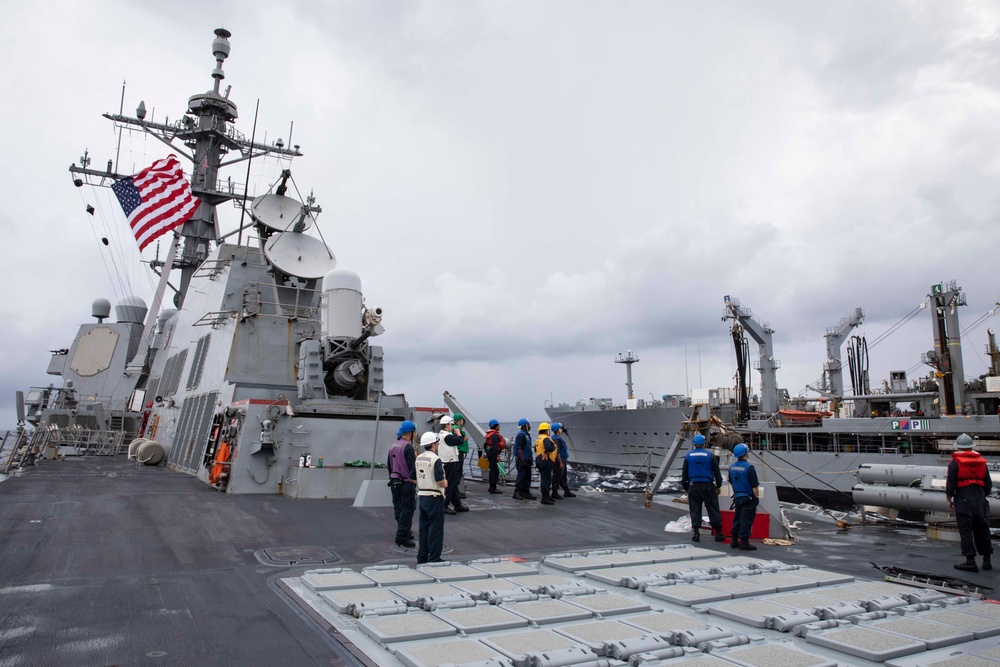 USS Ralph Johnson and His Majesty’s Canadian Ship (HMCS) Ottawa (FFH 341) conduct a replenishment-at-sea with the USNS Yukon.