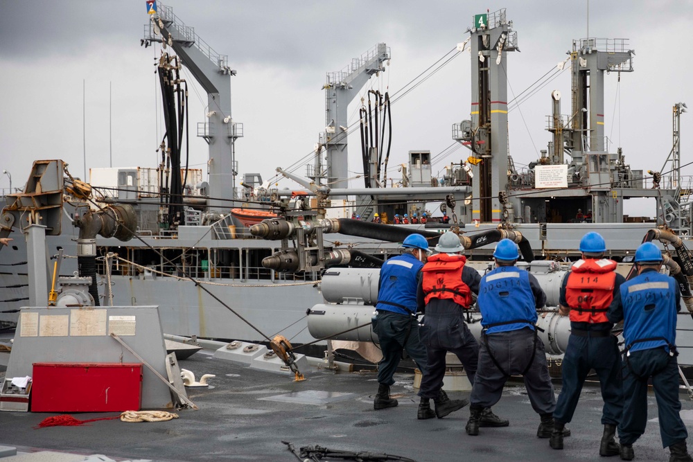 USS Ralph Johnson and His Majesty’s Canadian Ship (HMCS) Ottawa (FFH 341) conduct a replenishment-at-sea with the USNS Yukon.