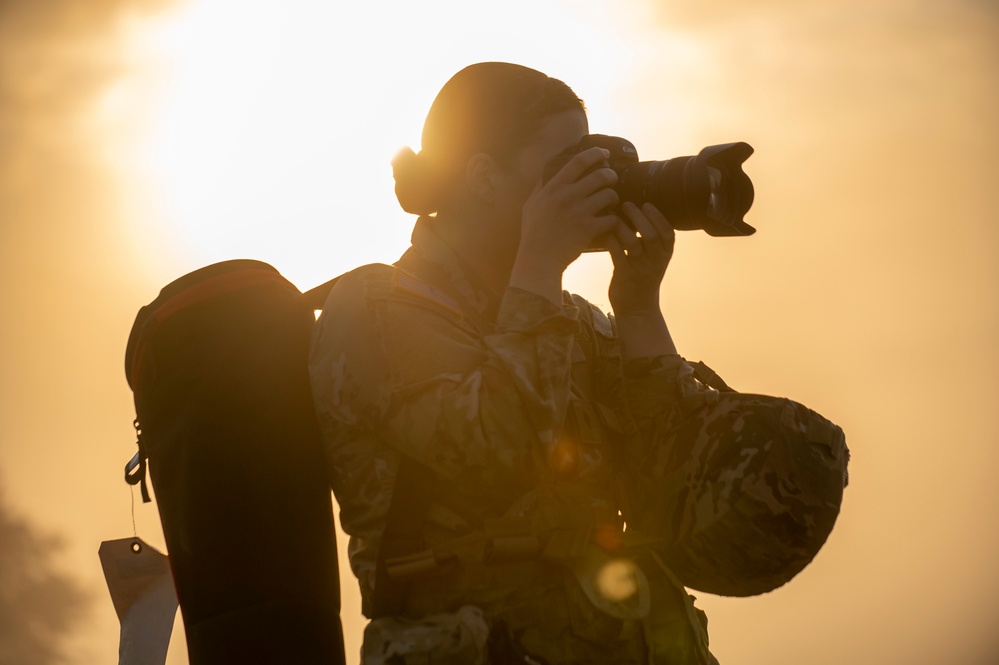 Soldiers stand watch at sunrise during Saber Junction 23