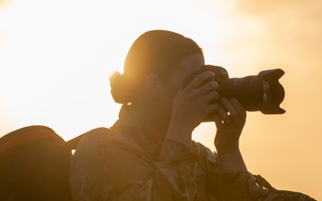 Soldiers stand watch at sunrise during Saber Junction 23
