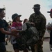 Airmen fly over and join FWB, Navarre Friday night football games