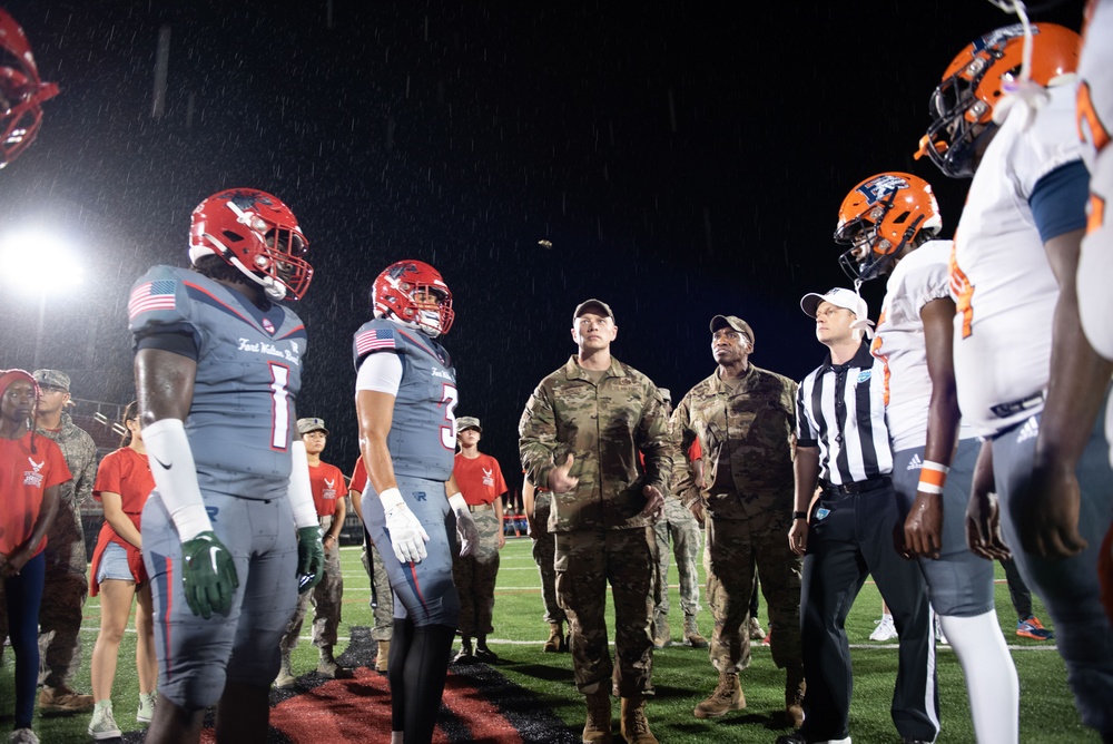 Airmen fly over and join FWB, Navarre Friday night football games