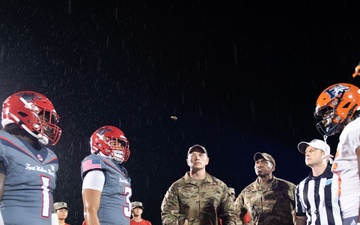Airmen fly over and join FWB, Navarre Friday night football games