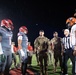 Airmen fly over and join FWB, Navarre Friday night football games