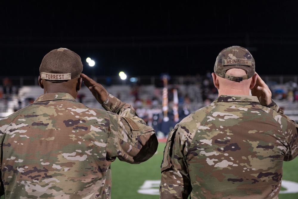 Airmen fly over and join FWB, Navarre Friday night football games