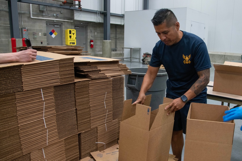 Sailors from NMCB 4 and the Navy Ceremonial Guard visit the Bishop's Storehouse for Salt Lake City Navy Week