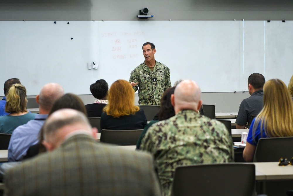 Commander, NSWC, briefs APEX Attendees