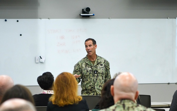 Commander, NSWC, briefs APEX Attendees
