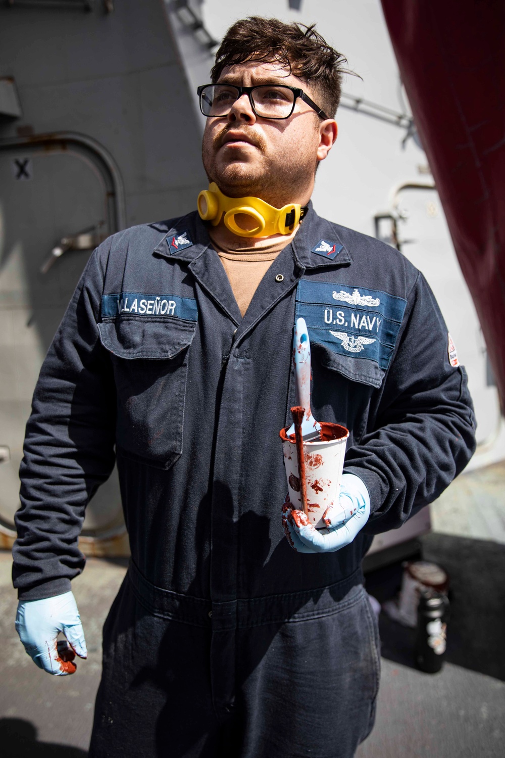 USS Ralph Johnson conducts paint preservation.