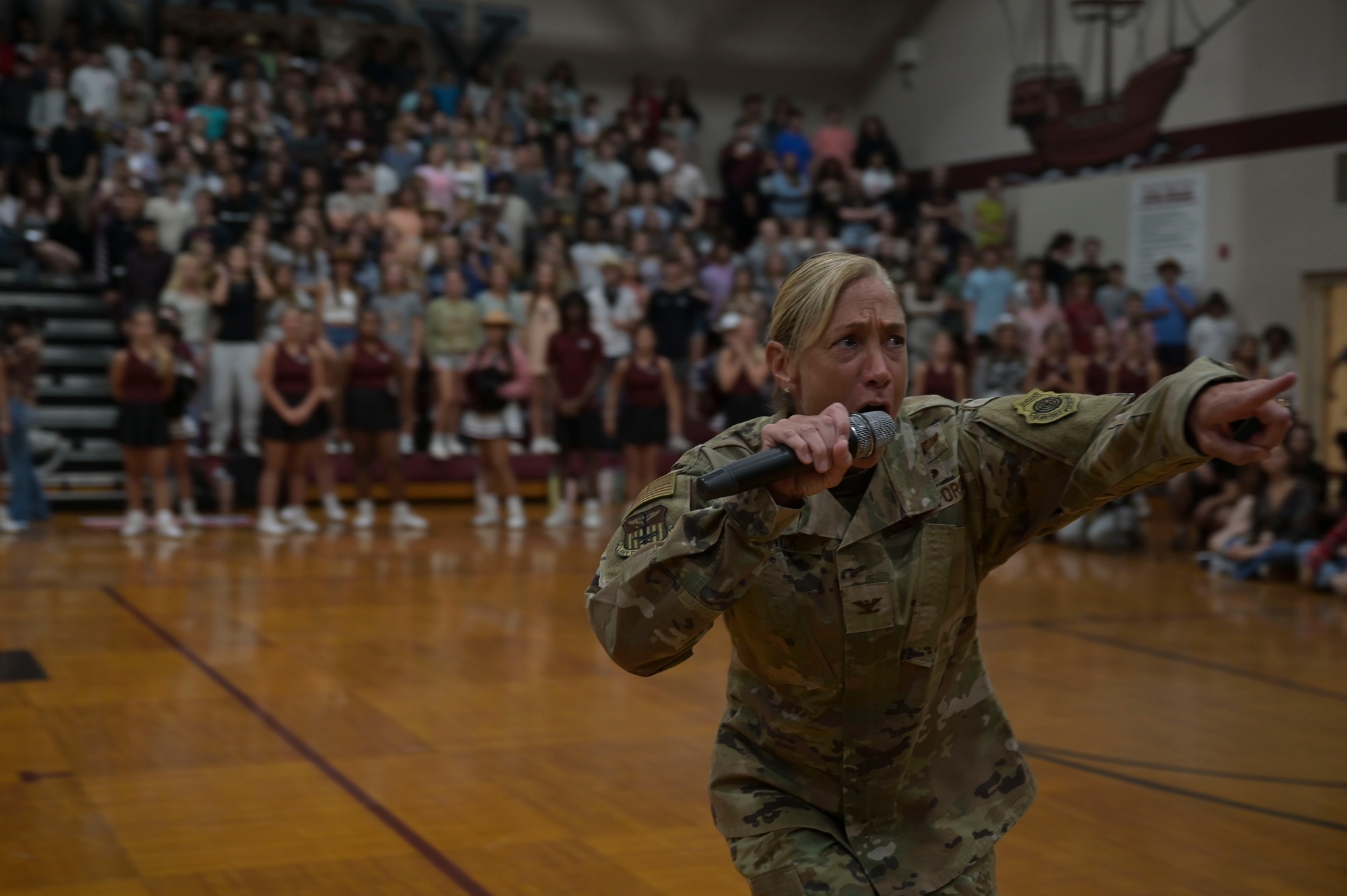 Airmen fly over and join FWB, Navarre Friday night football games