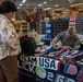 U.S. Marine Corps Capt. Riley Trejcek, an Olympic bobsledder, signs autographs at the commissary on Marine Corps Base Quantico