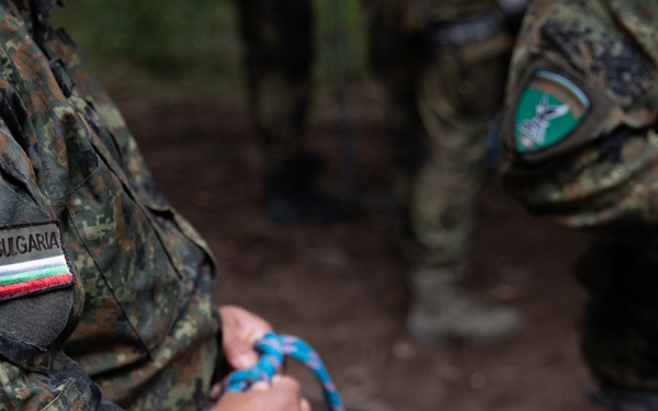 Soldiers from 10th Mountain Division and Bulgarian Land Forces 101st Alpine Regiment participate in the Rhodope 23 mountain movement technique in high-angle terrain event on Sep. 18, 2023, near Smolyan, Bulgaria