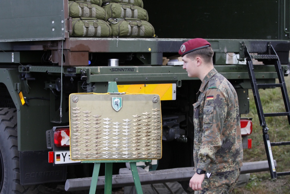 German Soldier prepares jump wings to be presented during Falcon Leap